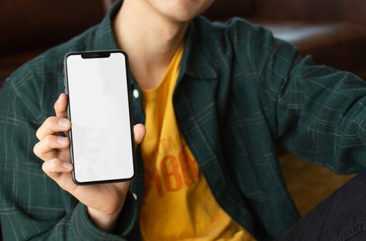 Generate iPhone Mockups with a Young Man Holding the Device