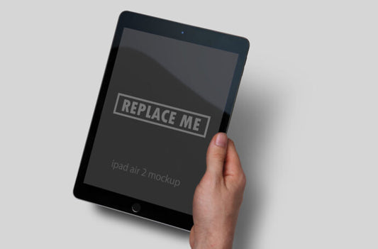 Hand Holding Black iPad Mockup