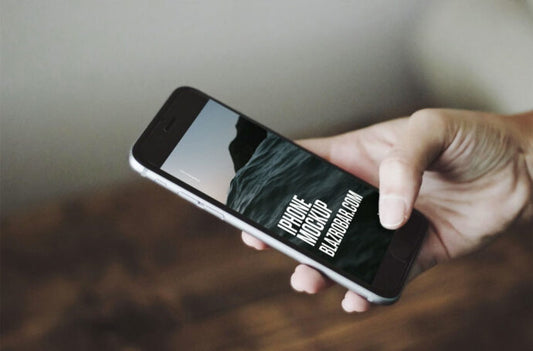 Hand Holding iPhone Mockup