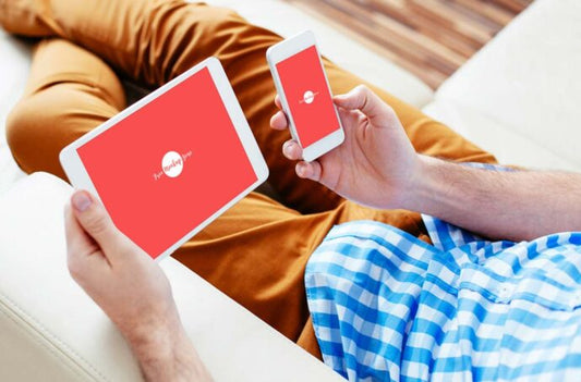 Man using iPad and iPhone mockup