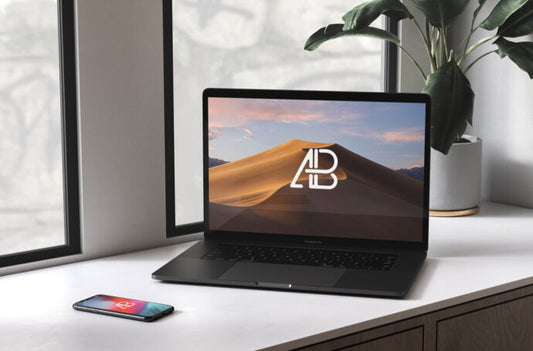 Mockup of Black MacBook and iPhone on Window Sill