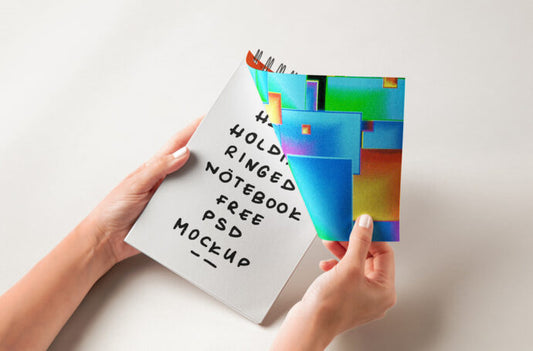 Mockup of Spiral Notebook being held by hands