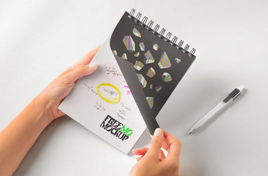 Mockup of Spiral Ring Notepad being held by hands