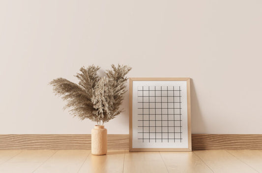 Mockup of a Leaning Wooden Picture Frame against a Wall