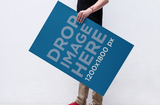 Mockup of a Man Holding a Poster in Hand