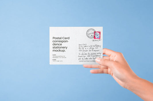 Mockup of a Postcard being Held by a Hand