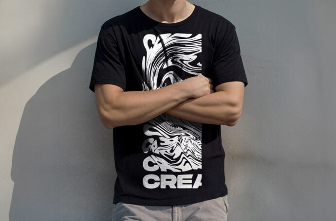 Mockup of a Young Man Wearing a Black T-Shirt with Print