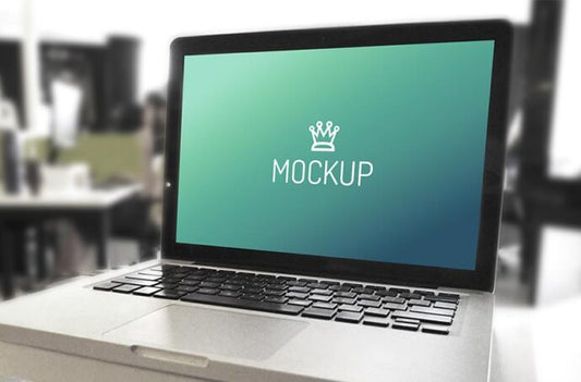 Mockups of MacBook and iPhone in an Office Setting