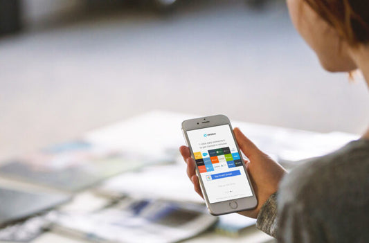 Woman using iPhone to read