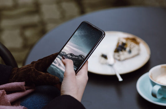 iPhone X Mockup with Woman Holding Device